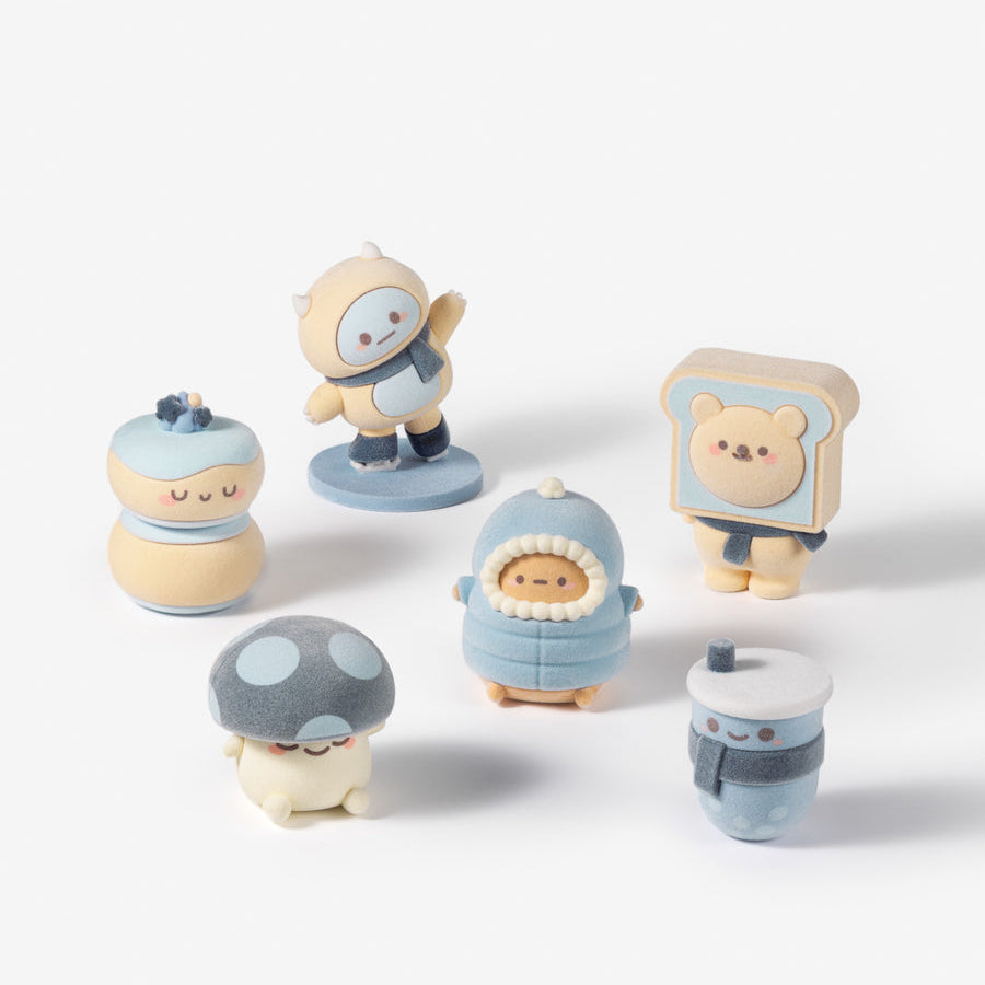 A set of six small, cute, pastel-colored collectible figurines arranged on a clean white background. The characters include a sleeping figure in a blue blanket, a mushroom character, a robot, a sleeping figure in a bread slice, a sleeping figure in a cup, and another sleeping figure in a blue helmet.