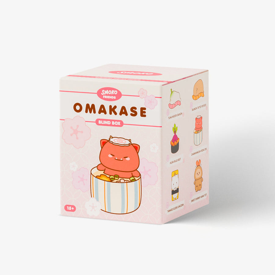 A light pink box of Sakai Omakase Bling Bling Nip, featuring cute cartoon illustrations of a pink bear and various food items on the sides, set against a plain white background.