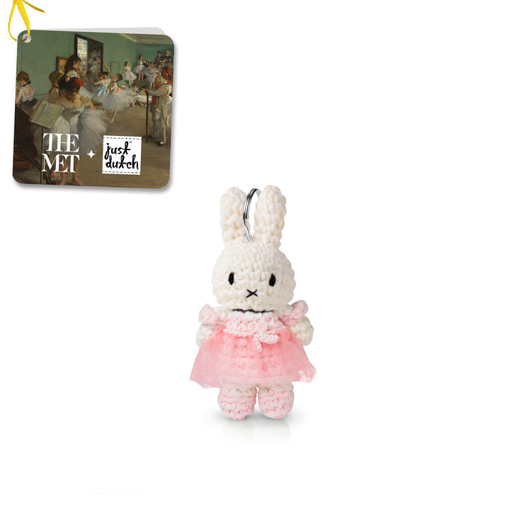 Plush bunny keychain in a pink dress with 'The Met' and 'Just Dutch' branding on a white background.