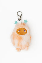 Plush keychain with a cute face design on a white background