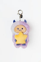 Plush keychain with a star-shaped body and purple hair on a white background