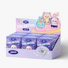 A display box filled with small SMOKO 'CELESTIAL' blind box packs, decorated with pastel cartoon characters and stars on a clean white background.