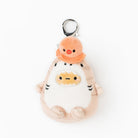 Plush toy with a small orange character on a white background