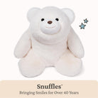 White teddy bear plush toy with 'Snuffles' branding on a white background
