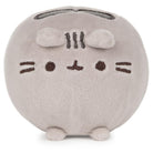 Mocha round plush toy with a simple face design on a white background