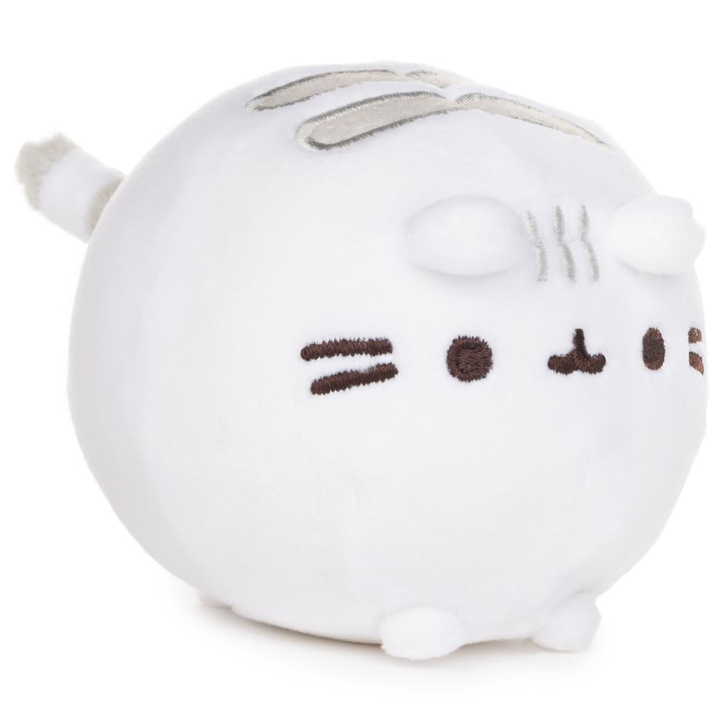 White round plush toy with a simple face design on a white background side view