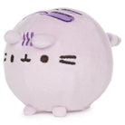 lavender round plush toy with a simple face design on a white background side view