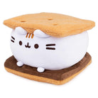 Plush toy resembling a cat inside a S'more on a white background