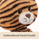Plush tiger toy with embroidered facial details on a white background