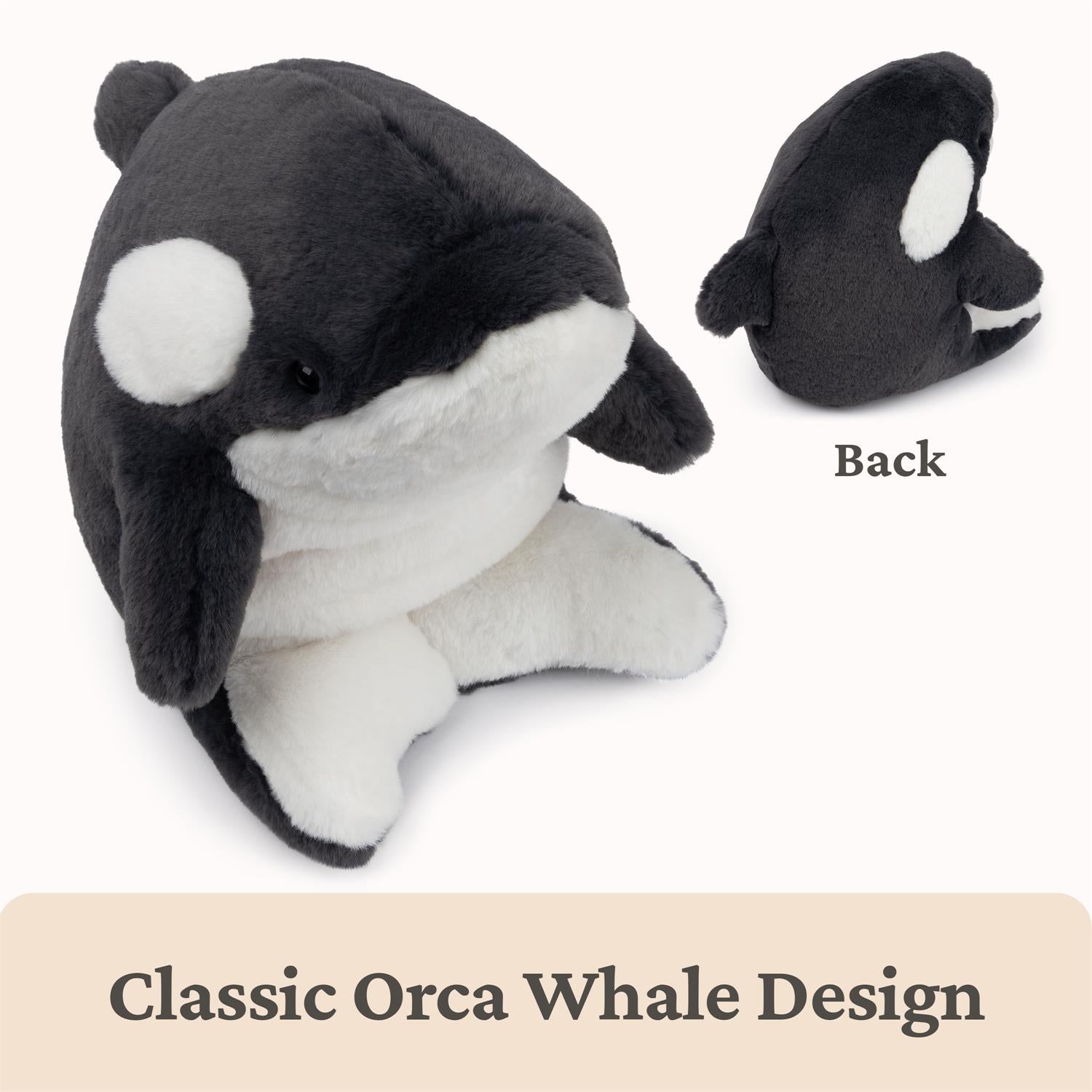 Plush toy orca whale with a back view on a white background