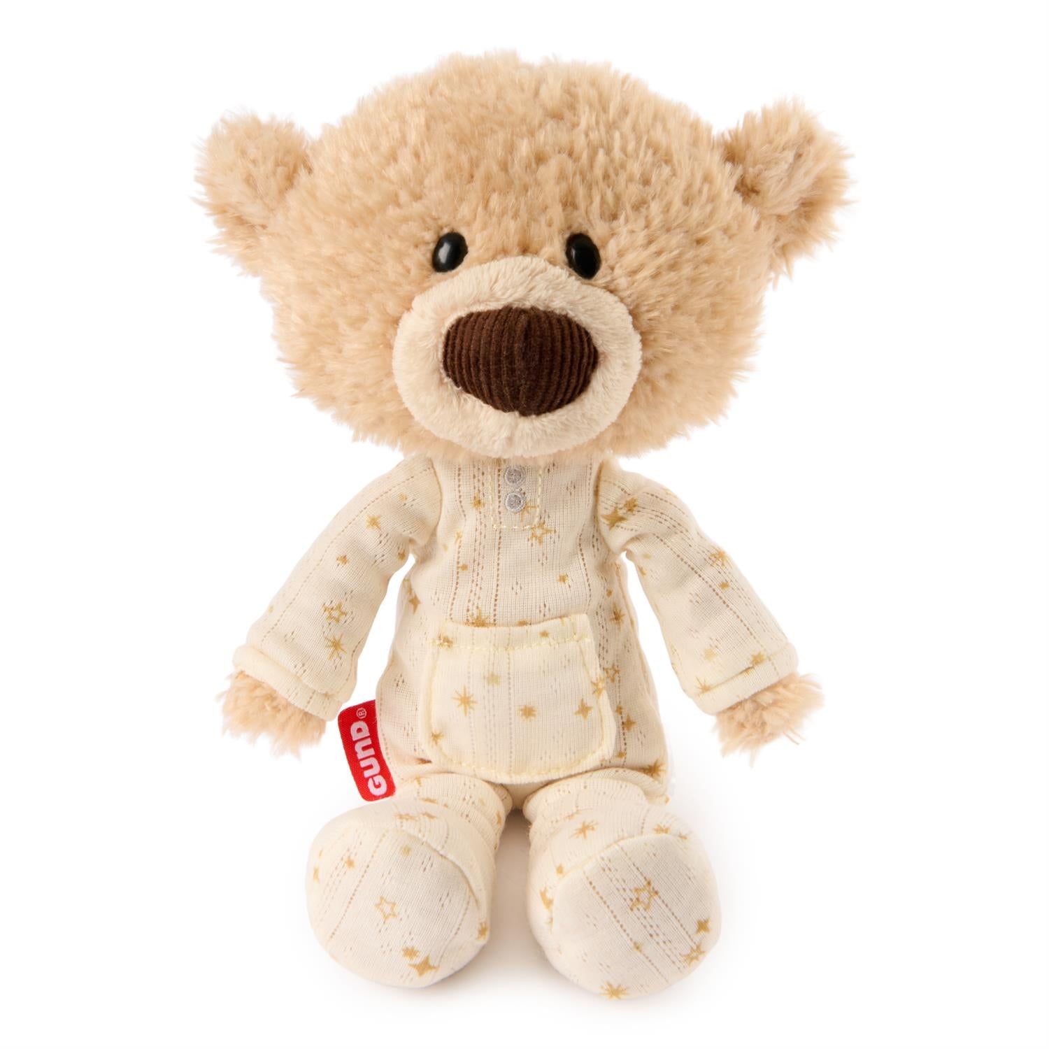 Plush teddy bear in pajamas with a visible brand tag on a white background