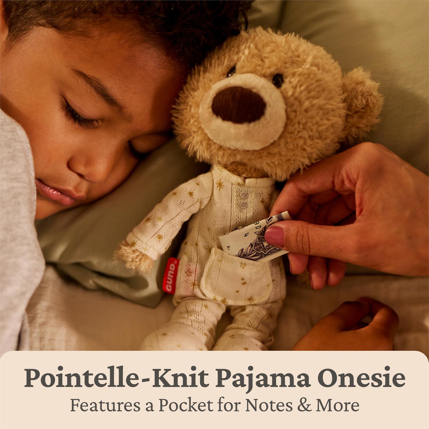 Person lying down with a teddy bear wearing a Pointelle-Knit Pajama Onesie, with text about the onesie's features.