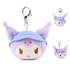 Plush keychain with a character wearing a blue hat and purple outfit on a white background