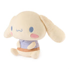 Plush toy resembling a character with large ears on a white background