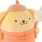 Cute plush toy with a round face and peach-colored outfit on a white background