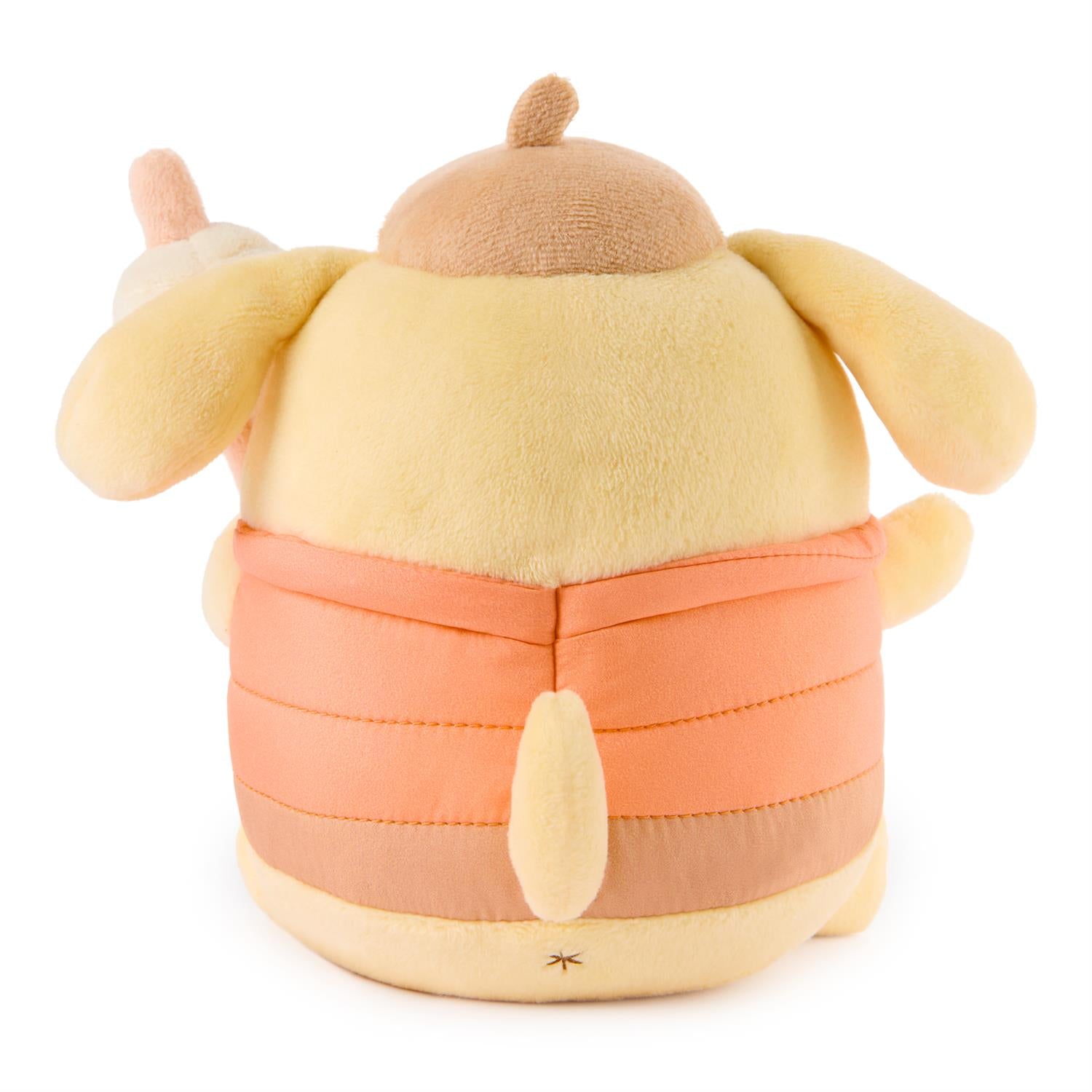 Plush toy resembling a cartoon character with a round body and peach-colored outfit on a white background