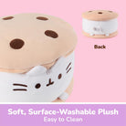 A plush cat-shaped stool designed to look like a cookie, with a tan top, dark brown spots, and a white cat face on the side. A smaller inset shows the back view.