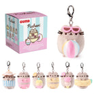 Pusheen plush keychain with packaging and additional keychains on a white background