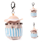 Plush keychain of a cat character wearing a hat and striped towel on a white background