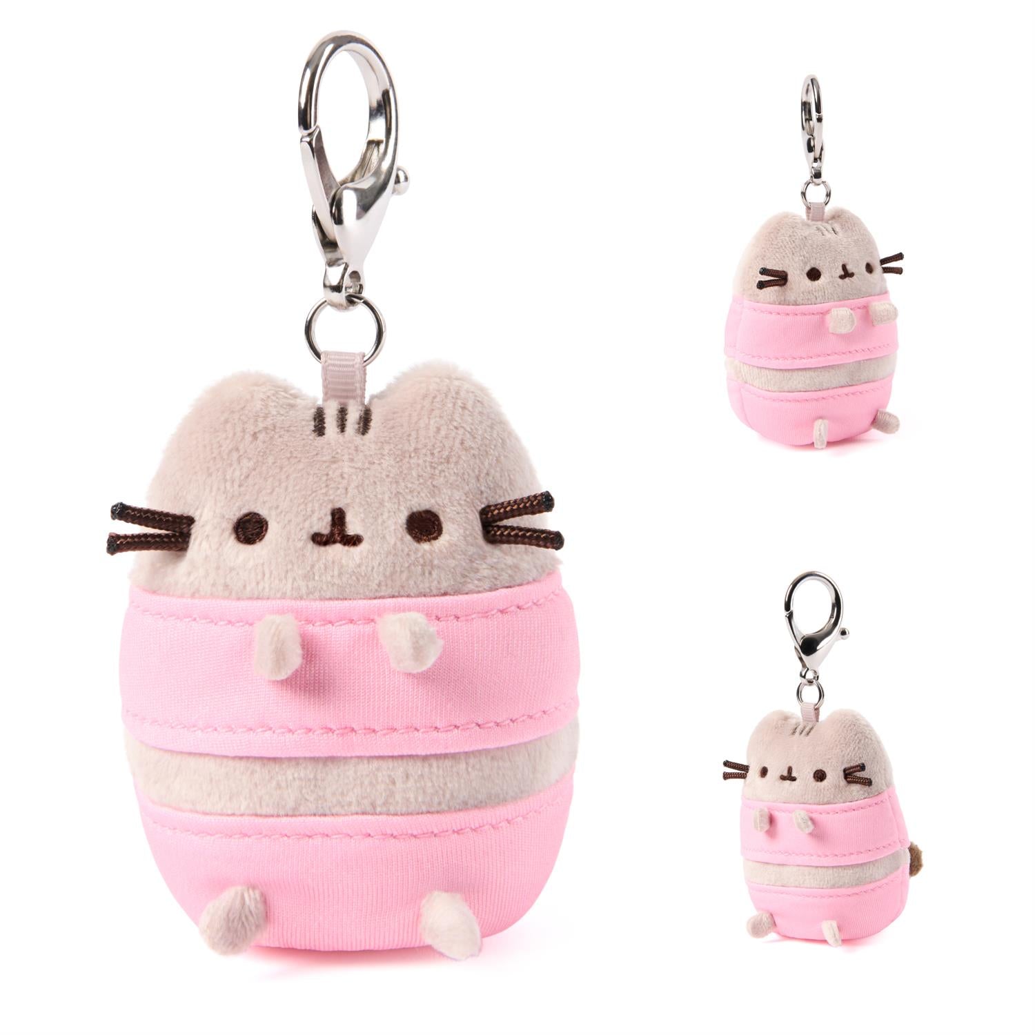 Plush keychain of a cat character in a pink outfit on a white background