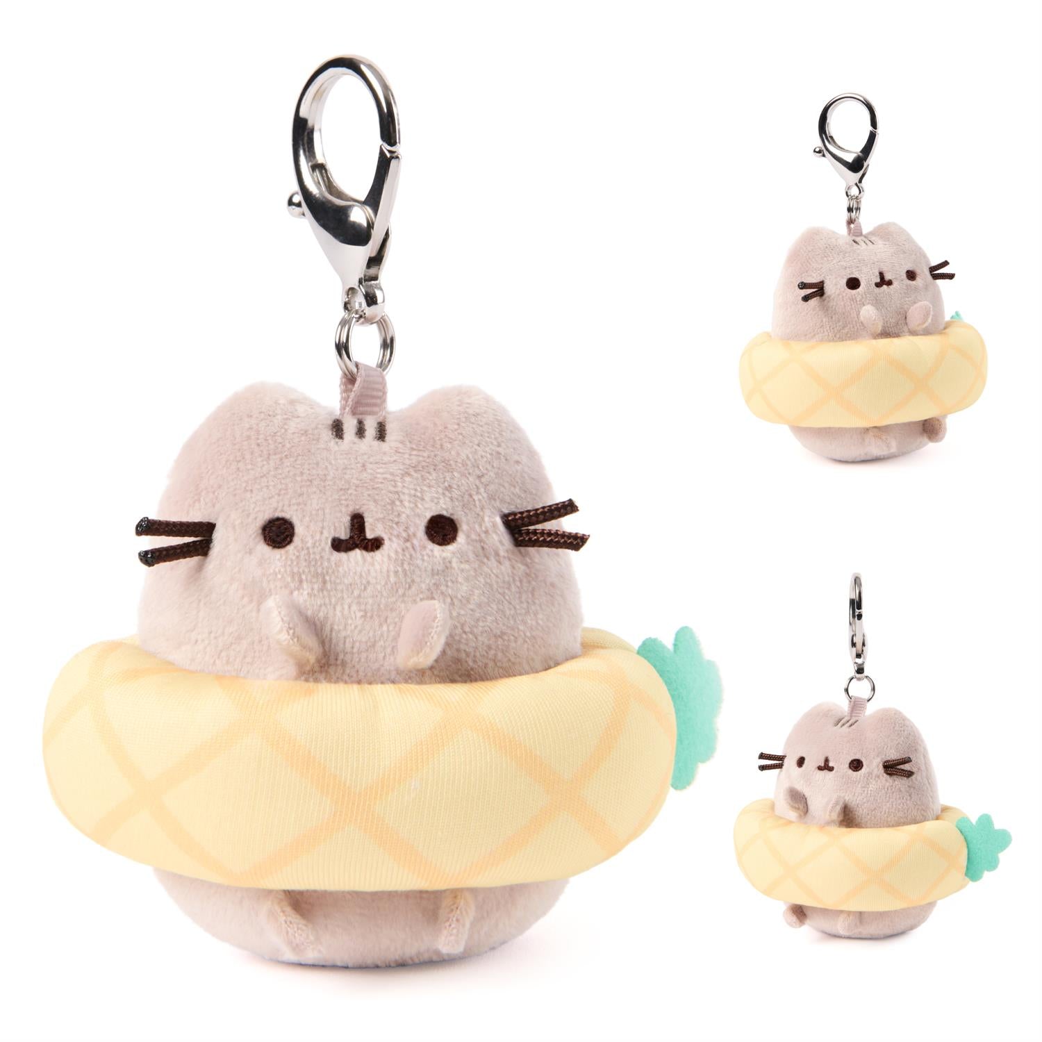 Plush keychain of a cat character in a pineapple costume on a white background