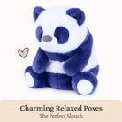 A plush panda toy sitting upright, with dark blue and white fur, a small pink heart graphic to the left, and text at the bottom reading 'Charming Relaxed Poses The Perfect Slouch' on a light beige background.