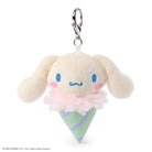 Plush keychain in the shape of a character with a cone and flower design on a white background