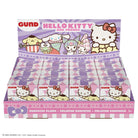 A retail display box filled with Hello Kitty and Friends Gund surprise plush packs, featuring Sanrio branding and character artwork on the packaging.
