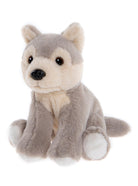 Plush toy wolf sitting on a white background
