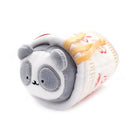 Stuffed panda toy wrapped in a patterned cloth.