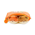 Orange and tan plush slippers in a zippered orange plush pouch.