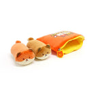 Two plush, cylindrical dog toys next to an orange pouch with a yellow lining and cartoon design.