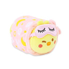 Stuffed chick wearing a sleeping mask and wrapped in a blanket.