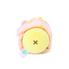 Yellow stuffed toy with brown stitched X detail and a pink blanket.
