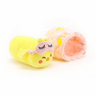 A yellow stuffed chick with a pink sleep mask and a pink plush tunnel with a moon and stars pattern.
