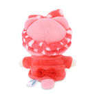 Rear view of a pink plush toy wearing a red bathrobe.