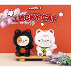 Two plush toys resembling a black and a white cat on a wooden stand with 'Anirollz' branding and 'Lucky Cat' text.