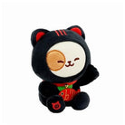 Plush toy with black cat-like design on a white background
