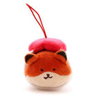 Plush toy fox with red strap.
