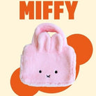 Pink plush bag with a face design on a beige background with 'MIFFY' text.