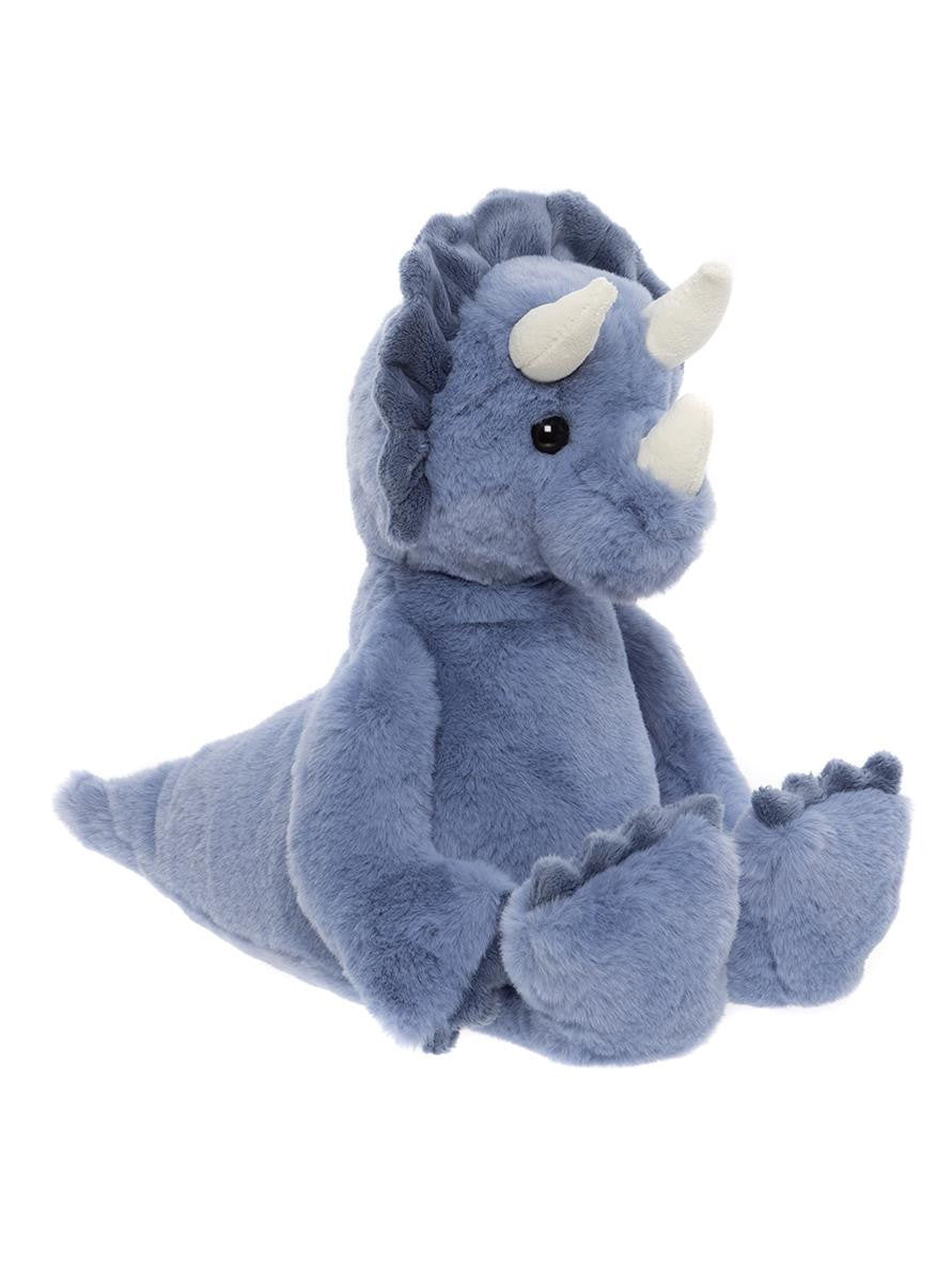 Plush toy dinosaur with blue fur and white horns on a white background