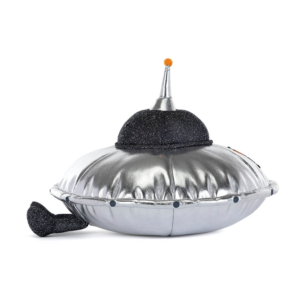 Silver plush flying saucer toy with black glitter dome and orange antenna by Jellycat, side view with textured metallic finish and black tail.