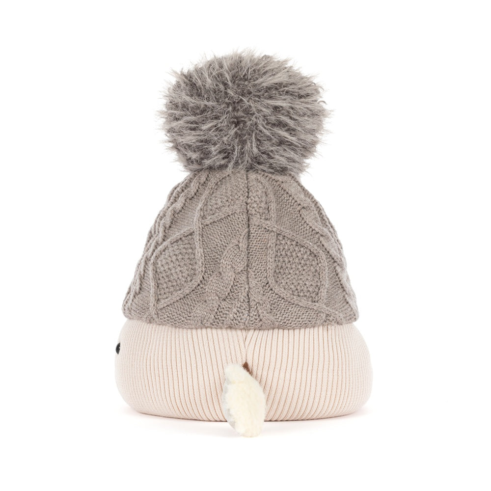 A knit pom-pom beanie hat with a textured cable-knit top section in taupe gray and a ribbed bottom section in cream, featuring a fluffy gray pom-pom on top and a small white tail detail.