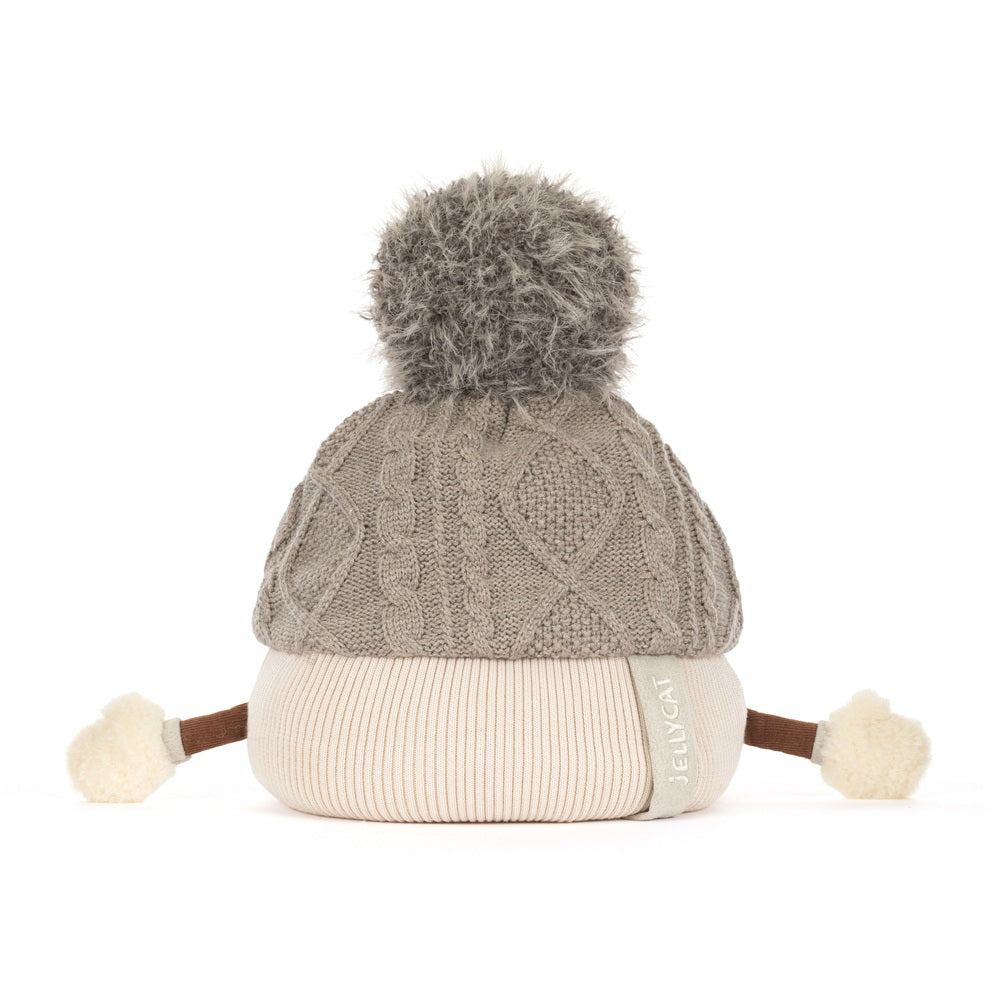 A gray cable-knit beanie hat with a fluffy gray pom-pom on top, a cream ribbed brim, and small cream pom-poms on the sides, photographed on a white background.