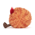 Orange fuzzy plush planet Mars toy by Jellycat with red tuft and brown legs, side view