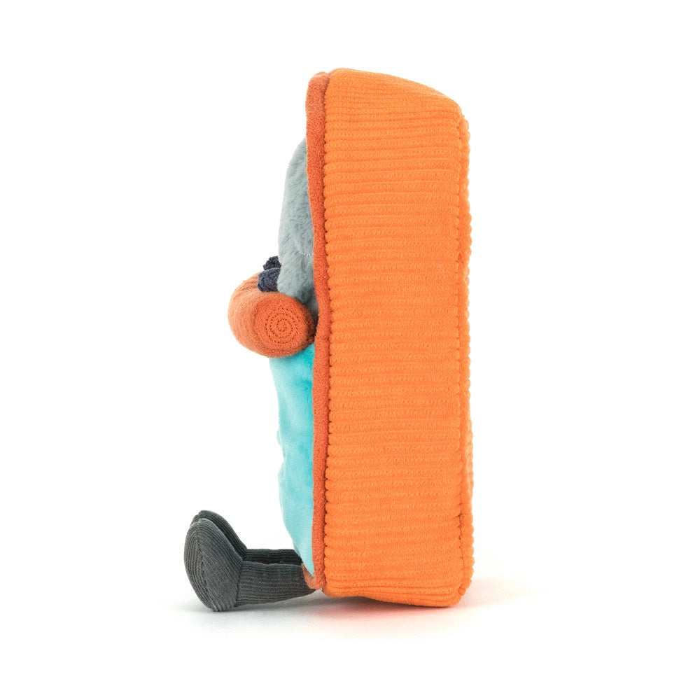 Stuffed toy bus with blue shirt and gray shoes.
