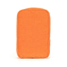 Orange corduroy cushion on white background.