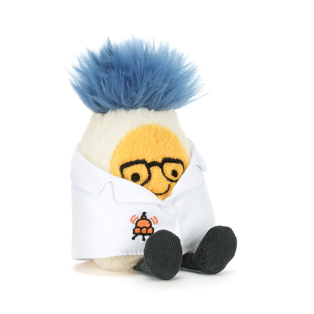Soft plush boiled egg toy with blue fluffy hair and glasses, wearing white lab coat with orange beaker emblem, by Jellycat, seated front view