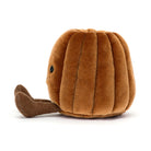 Brown plush toy resembling a shell on a white background