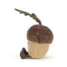 Toy acorn with a brown top and beige bottom on a white background